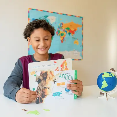 Student studying geography and culture using a KiwiCo Atlas Crate.