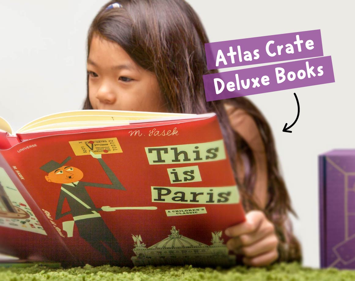 Child reading an Atlas Geography Crate Deluxe Children’s Book
